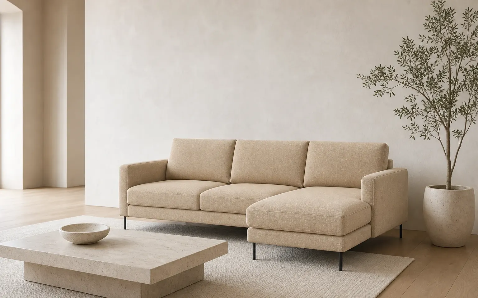 Configured sand-coloured modular sofa shown clearly in a calm living room